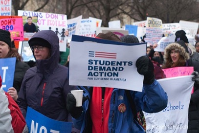 Students demand action for gun control in America sign of one of the marchers